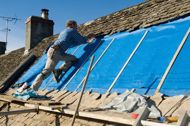 workers installing roofing